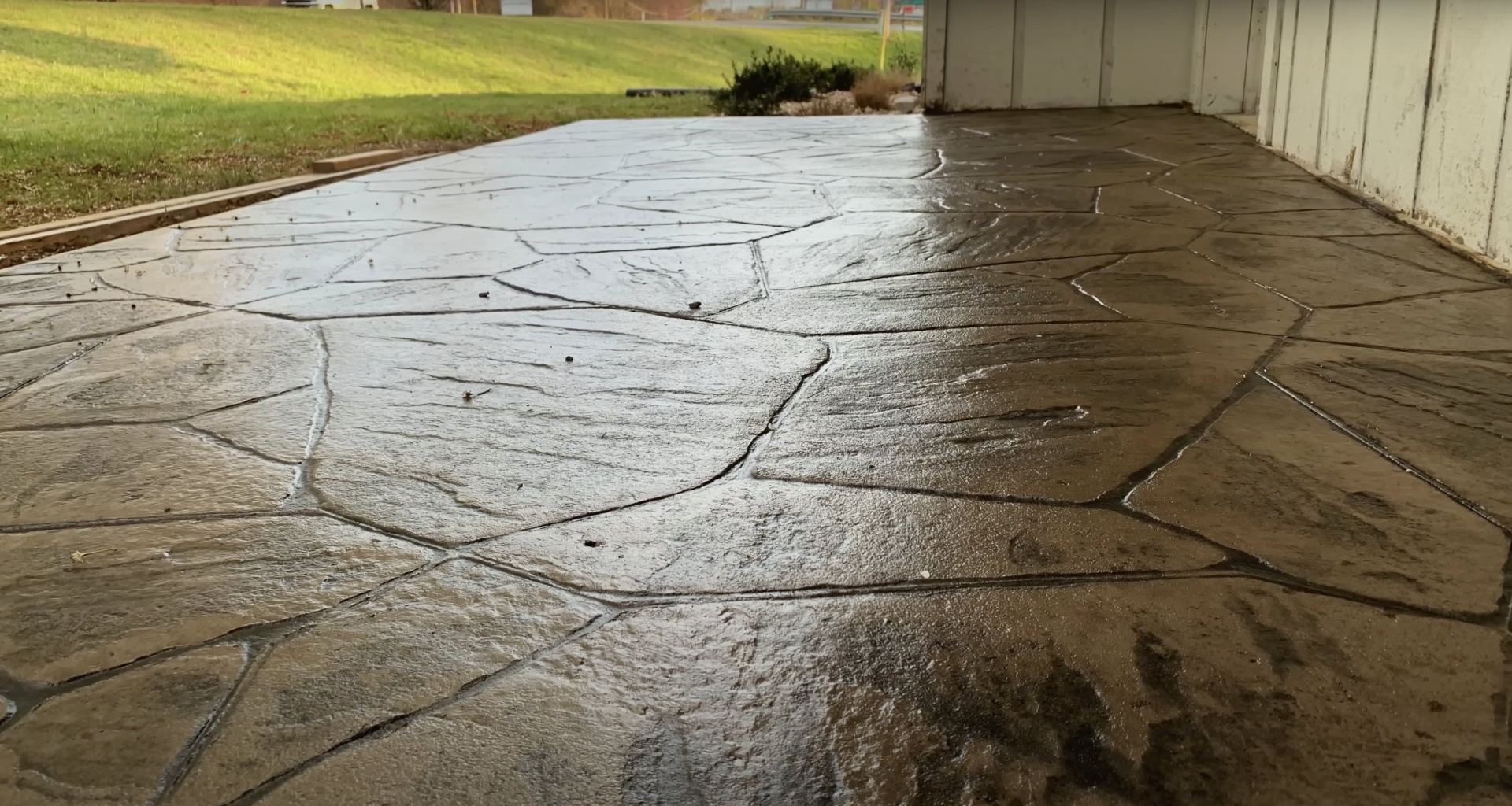 Damaged concrete driveway requiring professional repair by RegalCrest Kent Concrete Cracked concrete driveway showing need for professional concrete repair services