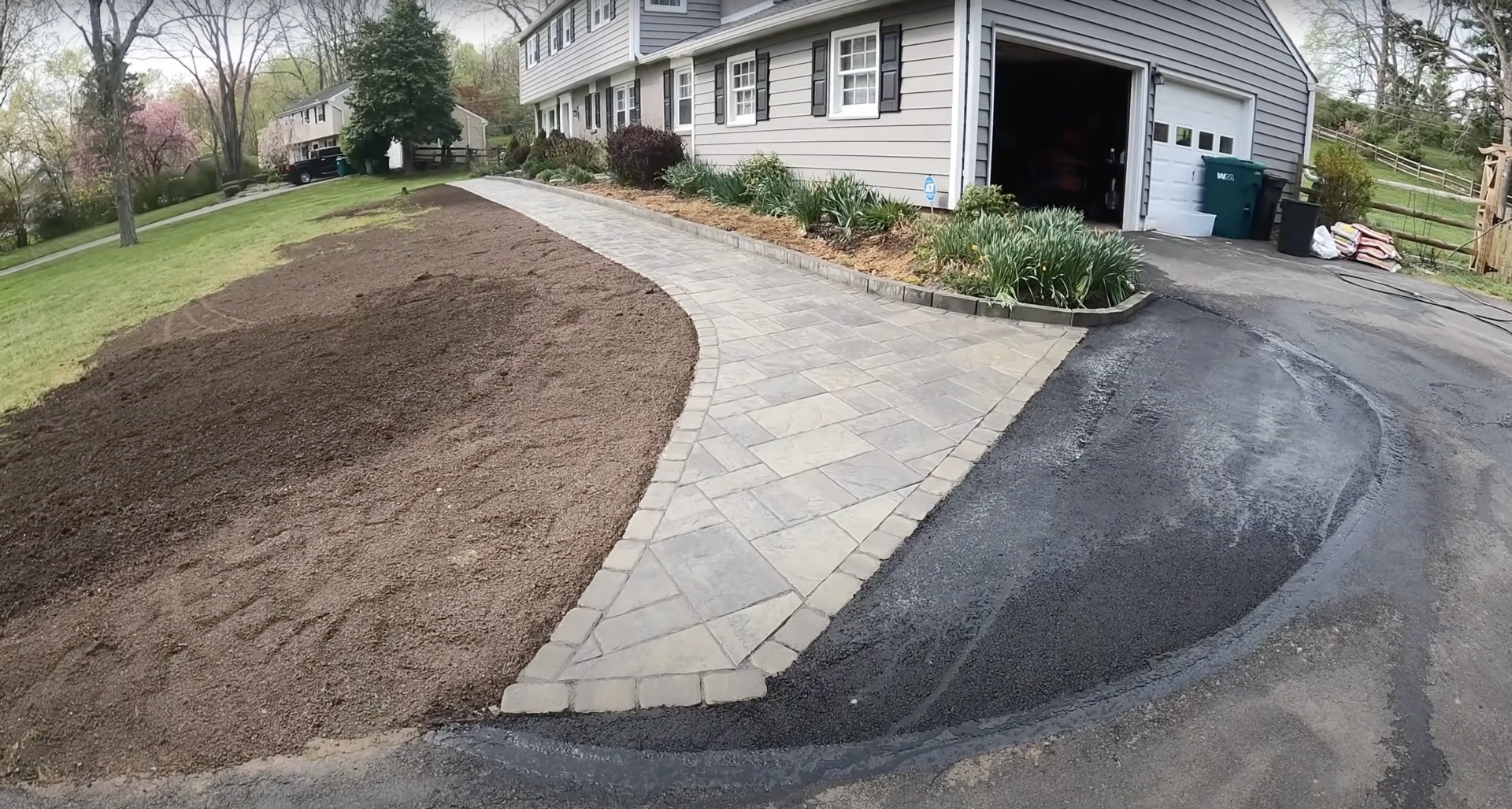 Beautiful curved concrete walkway with integrated paver design by RegalCrest Kent Concrete Curved concrete walkway and paver installation showing landscape integration