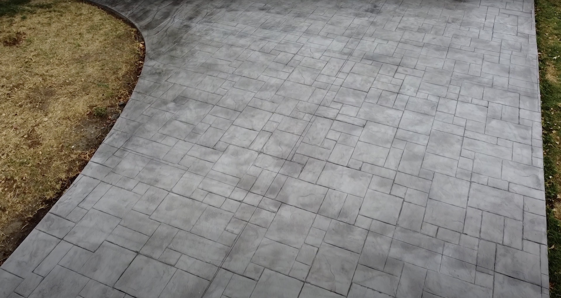 Custom stamped concrete patio with brick pattern by RegalCrest Kent Concrete Stamped concrete patio with brick pattern design showing decorative concrete installation